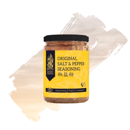 A glass jar of Golden Dragon Original Salt and Pepper Seasoning with a bright yellow label, featuring a black dragon logo and a "Vegan" certification mark.