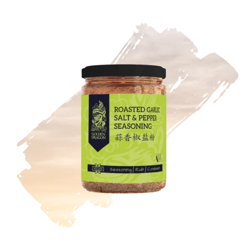A glass jar of Golden Dragon Roasted Garlic Salt and Pepper Seasoning with a lime green label, featuring a black dragon logo and a "Vegan" certification mark.
