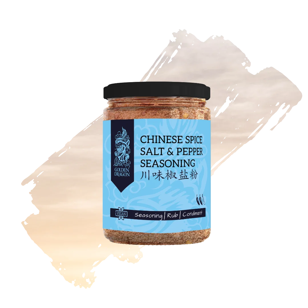 A glass jar of Golden Dragon Chinese Spice Salt and Pepper Seasoning with a light blue label, featuring a black dragon logo and a "Vegan" certification mark.